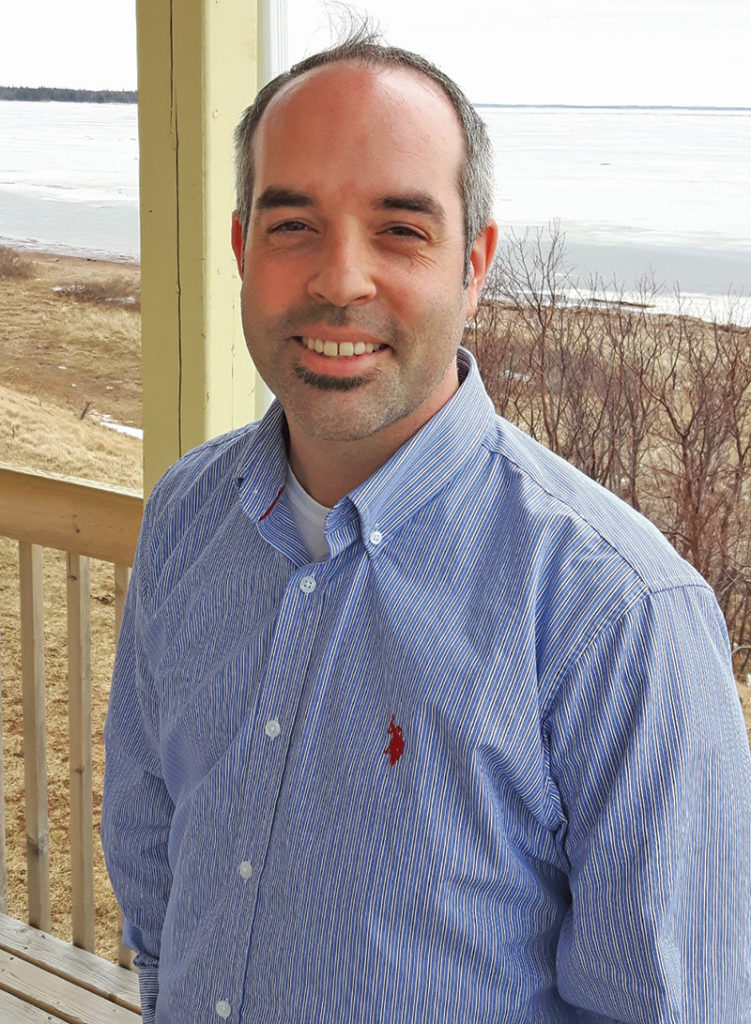 Mike Randall,  executive director of Lennox Island Development Corporation, poses at hatchery