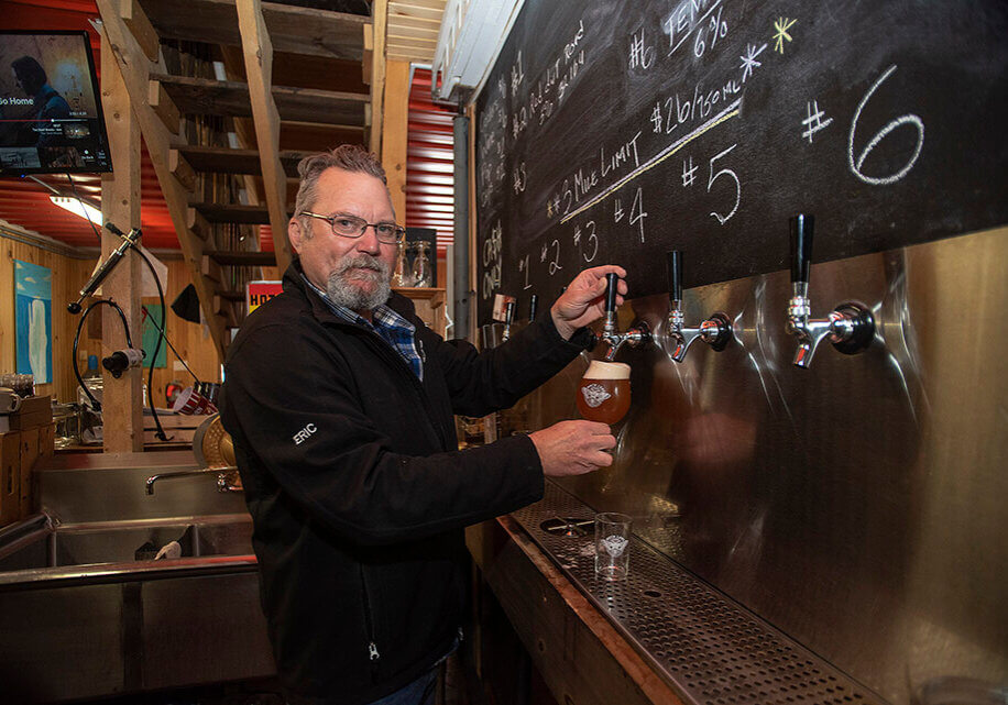 Eric Wagner pours a pint at Moth Lane Brewing Photo credit: Brian McInnis