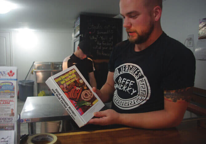 Chris van , owner of Butcher & Butcher, is inspired by classic sausage recipes from his grandmother's cookbook//Photo Credit: Jessica L. Fritz