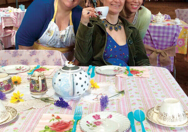 Abigayle Totty (centre) and Cherlyn Moffet (l) of Table Teas host a tea part for Jasmine Bastarache (r) of Venture Stables in Freetown// Photo credit: Sue Woodworth