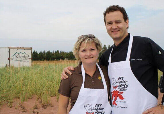 Tracey Singleton of Versatile Management Group with chef Corbin at Lobster Party on the Beach in 2013// Submitted Photo