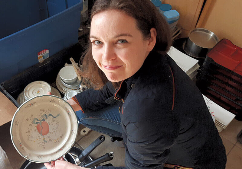 Sarah Forrester Wendt displays the plate featuring a plum and duck that she discovered while cleaning up the space where her new restaurant will be located.