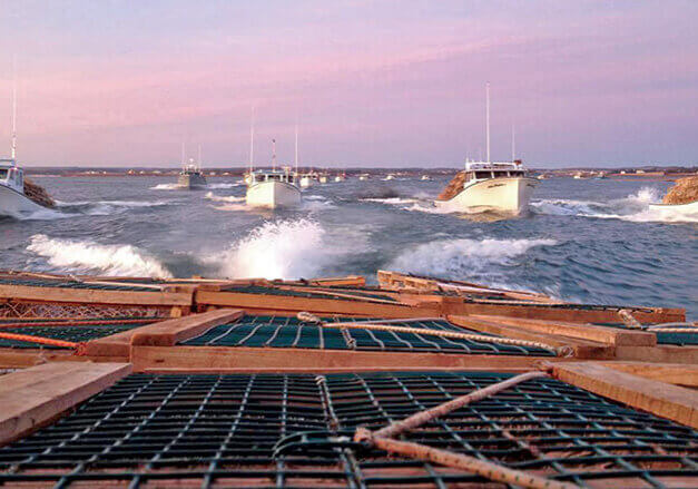 Fishing boats leaving the harbour to set their lobster traps